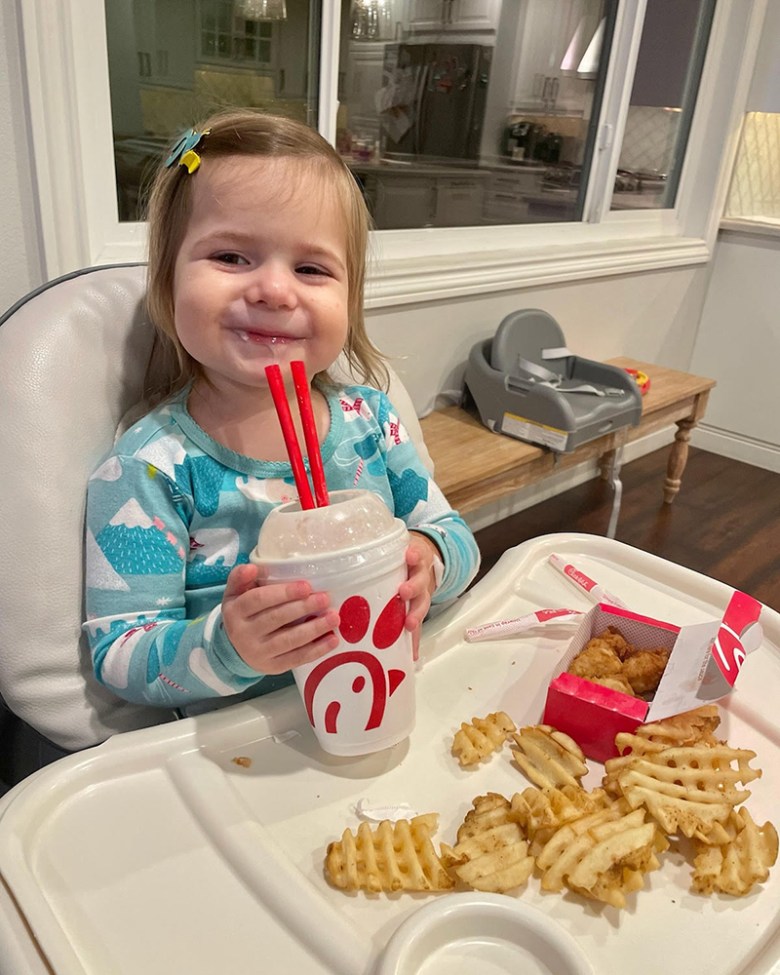 Adeline Zermeno, 2, in recovery after spending two night in the hospital because of COVID-19. Here she is enjoying her post-hospitalization meal. She requested Chik-fil-A. Photo courtesy of Lindsey Zermeno.