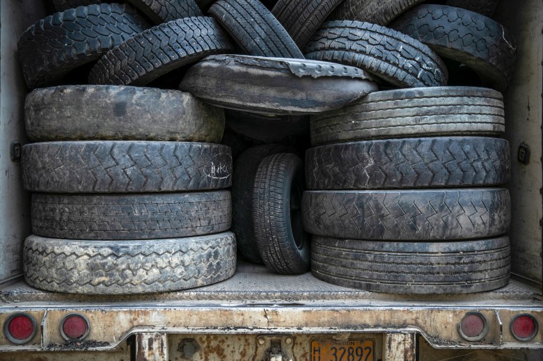Tires, which are used as an alternative to traditional fossil fuels, are stacked in the back of trucks delivering them to the Martin Marietta Redding Cement Plant in Redding on June 7, 2022. Photo by Martin do Nascimento, CalMatters